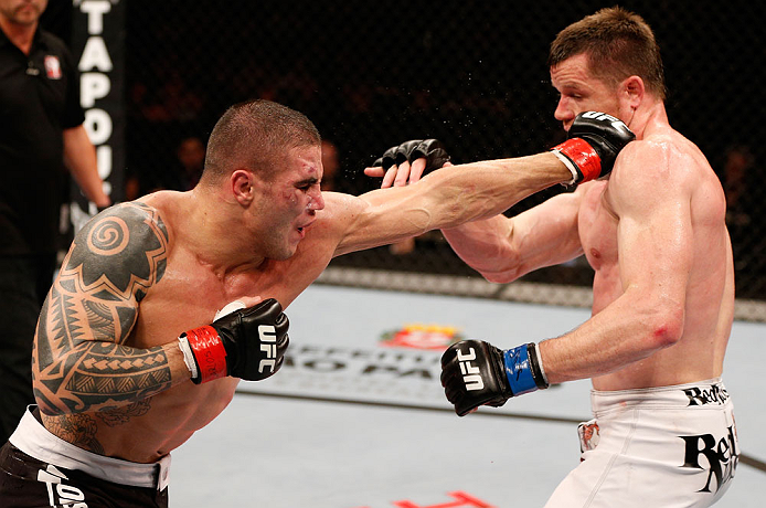 SAO PAULO, BRAZIL - JANUARY 19: (L-R) Daniel Sarafian punches C.B. Dolloway in their middleweight fight at the UFC on FX event on January 19, 2013 at Ibirapuera Gymnasium in Sao Paulo, Brazil. (Photo by Josh Hedges/Zuffa LLC/Zuffa LLC via Getty Images)