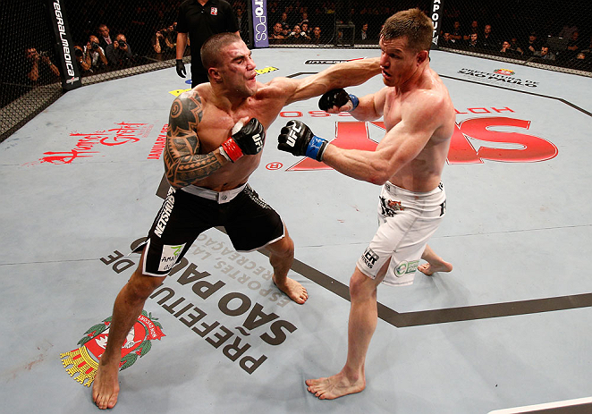 SAO PAULO, BRAZIL - JANUARY 19: (L-R) Daniel Sarafian punches C.B. Dolloway in their middleweight fight at the UFC on FX event on January 19, 2013 at Ibirapuera Gymnasium in Sao Paulo, Brazil. (Photo by Josh Hedges/Zuffa LLC/Zuffa LLC via Getty Images)