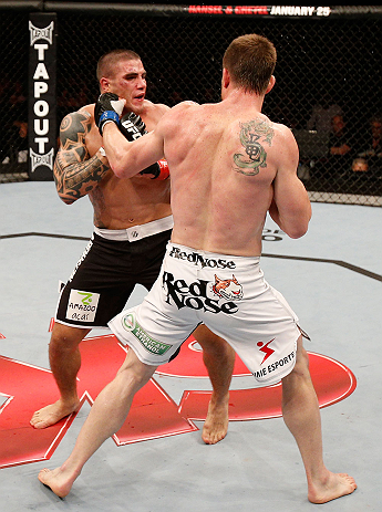SAO PAULO, BRAZIL - JANUARY 19: (R-L) C.B. Dolloway punches Daniel Sarafian in their middleweight fight at the UFC on FX event on January 19, 2013 at Ibirapuera Gymnasium in Sao Paulo, Brazil. (Photo by Josh Hedges/Zuffa LLC/Zuffa LLC via Getty Images)