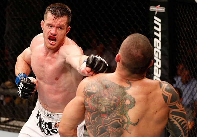 SAO PAULO, BRAZIL - JANUARY 19: (L-R) C.B. Dolloway punches Daniel Sarafian in their middleweight fight at the UFC on FX event on January 19, 2013 at Ibirapuera Gymnasium in Sao Paulo, Brazil. (Photo by Josh Hedges/Zuffa LLC/Zuffa LLC via Getty Images)