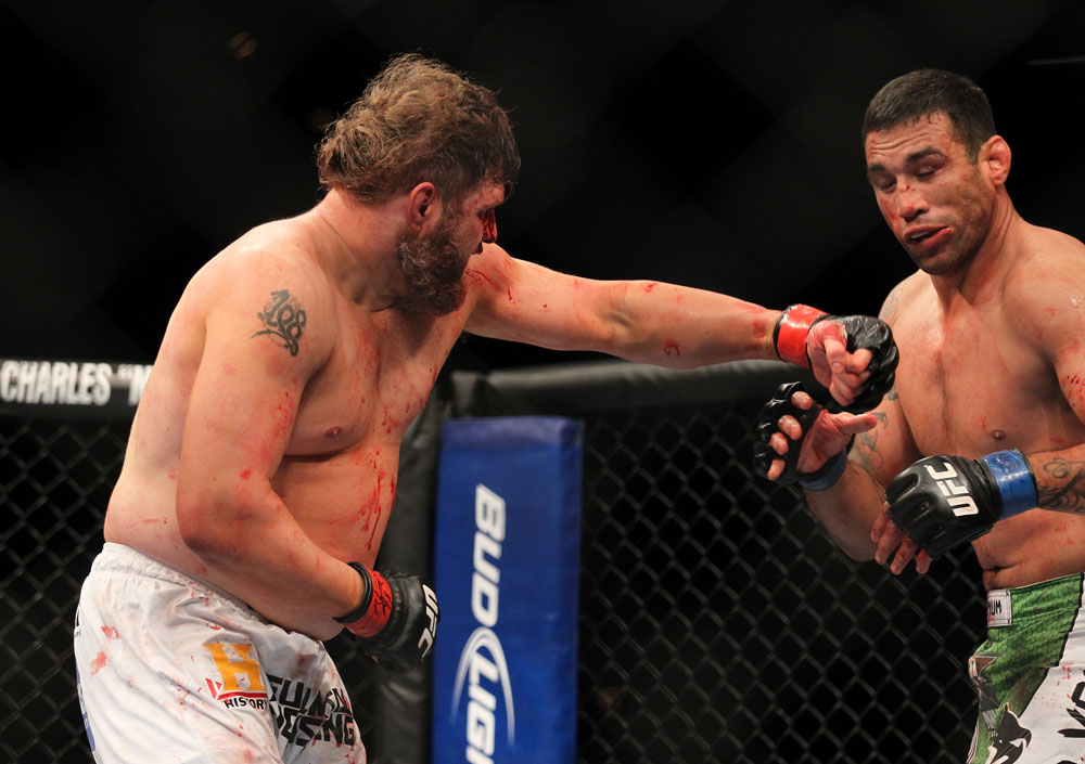 LAS VEGAS, NV - FEBRUARY 04:  Roy Nelson (left) punches Fabricio Werdum during the UFC 143 event at Mandalay Bay Events Center on February 4, 2012 in Las Vegas, Nevada.  (Photo by Josh Hedges/Zuffa LLC/Zuffa LLC via Getty Images) *** Local Caption *** Roy Nelson; Fabricio Werdum