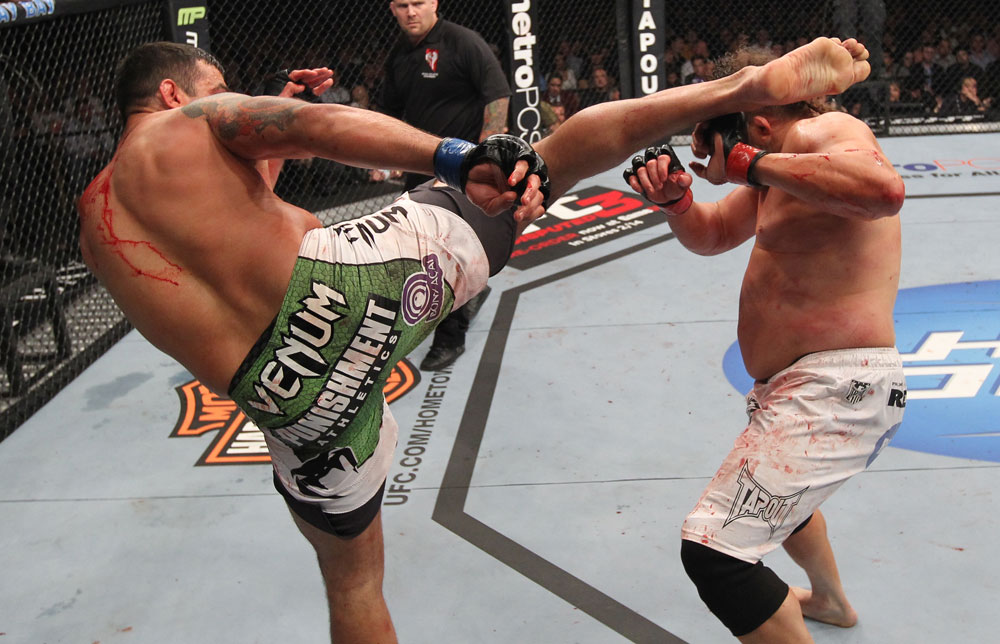 LAS VEGAS, NV - FEBRUARY 04:  Fabricio Werdum (left) headkicks Roy Nelson during the UFC 143 event at Mandalay Bay Events Center on February 4, 2012 in Las Vegas, Nevada.  (Photo by Nick Laham/Zuffa LLC/Zuffa LLC via Getty Images) *** Local Caption *** Fabricio Werdum; Roy Nelson