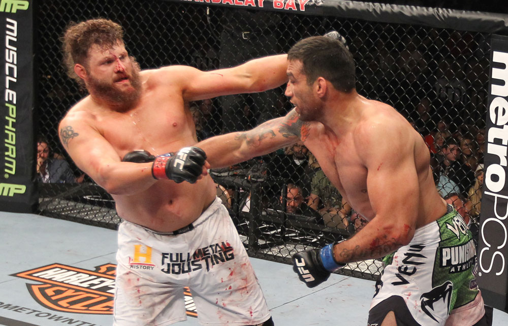 LAS VEGAS, NV - FEBRUARY 04:  (L-R) Roy Nelson and Fabricio Werdum exchange punches during the UFC 143 event at Mandalay Bay Events Center on February 4, 2012 in Las Vegas, Nevada.  (Photo by Nick Laham/Zuffa LLC/Zuffa LLC via Getty Images) *** Local Caption *** Fabricio Werdum; Roy Nelson