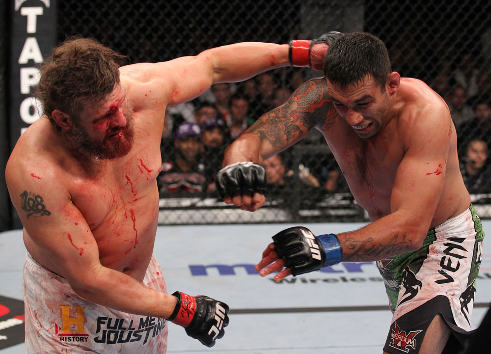 LAS VEGAS, NV - FEBRUARY 04:  (L-R) Roy Nelson punches Fabricio Werdum during the UFC 143 event at Mandalay Bay Events Center on February 4, 2012 in Las Vegas, Nevada.  (Photo by Nick Laham/Zuffa LLC/Zuffa LLC via Getty Images) *** Local Caption *** Roy Nelson; Fabricio Werdum