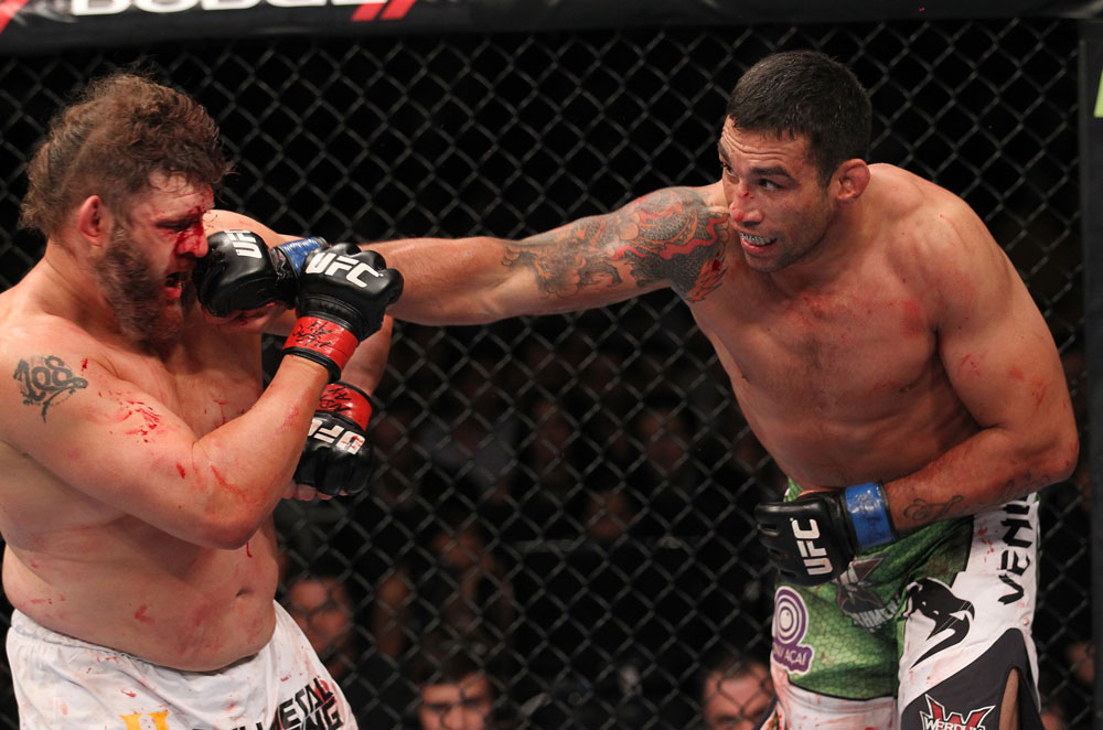 LAS VEGAS, NV - FEBRUARY 04:  (R-L) Fabricio Werdum punches Roy Nelson during the UFC 143 event at Mandalay Bay Events Center on February 4, 2012 in Las Vegas, Nevada.  (Photo by Nick Laham/Zuffa LLC/Zuffa LLC via Getty Images) *** Local Caption *** Fabricio Werdum; Roy Nelson