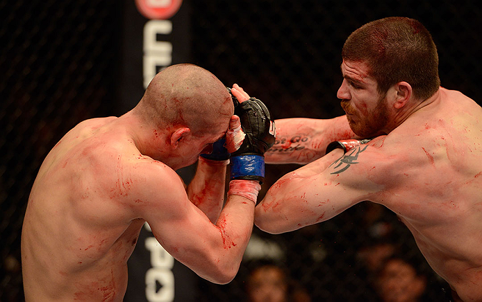 LAS VEGAS, NV - DECEMBER 29:  (R-L) Jim Miller elbows Joe Lauzon during their lightweight fight at UFC 155 on December 29, 2012 at MGM Grand Garden Arena in Las Vegas, Nevada. (Photo by Donald Miralle/Zuffa LLC/Zuffa LLC via Getty Images) *** Local Caption *** Joe Lauzon; Jim Miller