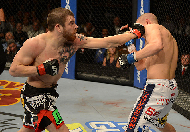 LAS VEGAS, NV - DECEMBER 29:  (L-R) Jim Miller punches Joe Lauzon during their lightweight fight at UFC 155 on December 29, 2012 at MGM Grand Garden Arena in Las Vegas, Nevada. (Photo by Donald Miralle/Zuffa LLC/Zuffa LLC via Getty Images) *** Local Caption *** Joe Lauzon; Jim Miller