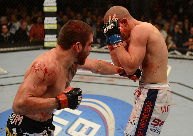 LAS VEGAS, NV - DECEMBER 29:  (L-R) Jim Miller punches Joe Lauzon during their lightweight fight at UFC 155 on December 29, 2012 at MGM Grand Garden Arena in Las Vegas, Nevada. (Photo by Donald Miralle/Zuffa LLC/Zuffa LLC via Getty Images) *** Local Caption *** Joe Lauzon; Jim Miller