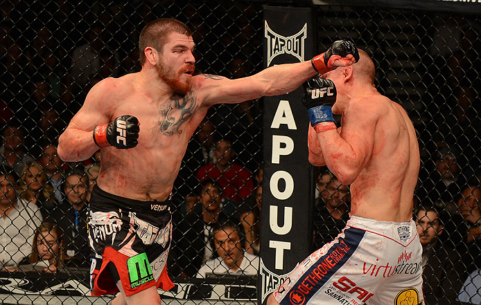LAS VEGAS, NV - DECEMBER 29:  (L-R) Jim Miller punches Joe Lauzon during their lightweight fight at UFC 155 on December 29, 2012 at MGM Grand Garden Arena in Las Vegas, Nevada. (Photo by Donald Miralle/Zuffa LLC/Zuffa LLC via Getty Images) *** Local Caption *** Joe Lauzon; Jim Miller