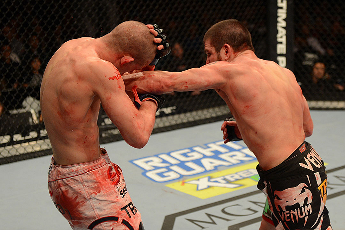 LAS VEGAS, NV - DECEMBER 29:  (R-L) Jim Miller punches Joe Lauzon during their lightweight fight at UFC 155 on December 29, 2012 at MGM Grand Garden Arena in Las Vegas, Nevada. (Photo by Donald Miralle/Zuffa LLC/Zuffa LLC via Getty Images) *** Local Caption *** Joe Lauzon; Jim Miller