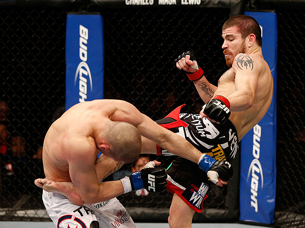 LAS VEGAS, NV - DECEMBER 29:  (R-L) Jim Miller kicks Joe Lauzon during their lightweight fight at UFC 155 on December 29, 2012 at MGM Grand Garden Arena in Las Vegas, Nevada. (Photo by Josh Hedges/Zuffa LLC/Zuffa LLC via Getty Images) *** Local Caption *** Joe Lauzon; Jim Miller
