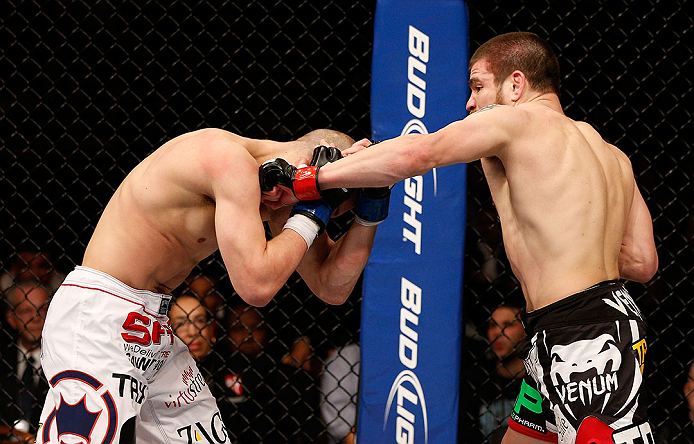 LAS VEGAS, NV - DECEMBER 29:  (R-L) Jim Miller punches Joe Lauzon during their lightweight fight at UFC 155 on December 29, 2012 at MGM Grand Garden Arena in Las Vegas, Nevada. (Photo by Josh Hedges/Zuffa LLC/Zuffa LLC via Getty Images) *** Local Caption *** Joe Lauzon; Jim Miller