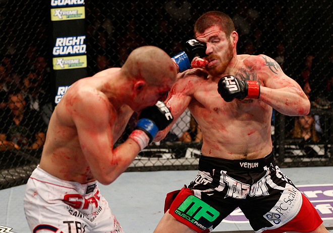 LAS VEGAS, NV - DECEMBER 29:  (R-L) Jim Miller punches Joe Lauzon during their lightweight fight at UFC 155 on December 29, 2012 at MGM Grand Garden Arena in Las Vegas, Nevada. (Photo by Josh Hedges/Zuffa LLC/Zuffa LLC via Getty Images) *** Local Caption *** Joe Lauzon; Jim Miller