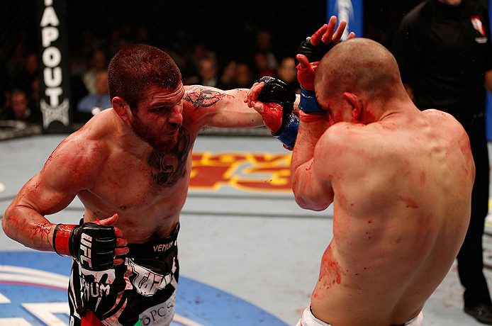 LAS VEGAS, NV - DECEMBER 29:  (L-R) Jim Miller punches Joe Lauzon during their lightweight fight at UFC 155 on December 29, 2012 at MGM Grand Garden Arena in Las Vegas, Nevada. (Photo by Donald Miralle/Zuffa LLC/Zuffa LLC via Getty Images) *** Local Caption *** Joe Lauzon; Jim Miller