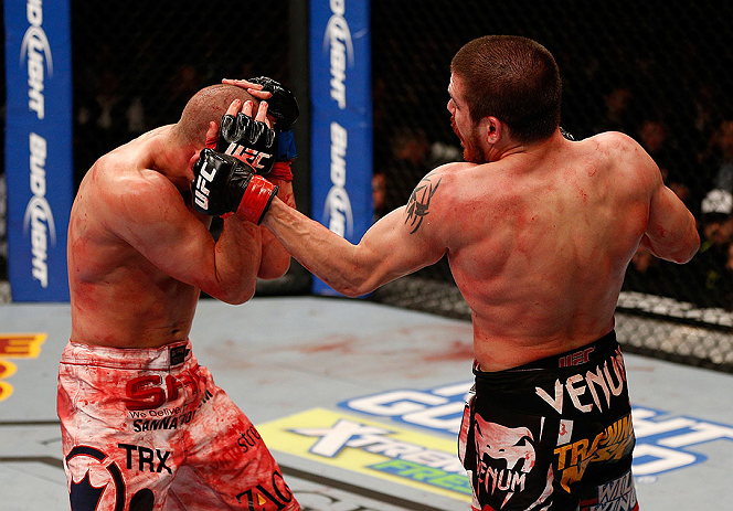 LAS VEGAS, NV - DECEMBER 29:  (R-L) Jim Miller punches Joe Lauzon during their lightweight fight at UFC 155 on December 29, 2012 at MGM Grand Garden Arena in Las Vegas, Nevada. (Photo by Josh Hedges/Zuffa LLC/Zuffa LLC via Getty Images) *** Local Caption *** Joe Lauzon; Jim Miller