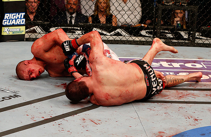LAS VEGAS, NV - DECEMBER 29:  Joe Lauzon (left) attempts to submit Jim Miller during their lightweight fight at UFC 155 on December 29, 2012 at MGM Grand Garden Arena in Las Vegas, Nevada. (Photo by Josh Hedges/Zuffa LLC/Zuffa LLC via Getty Images) *** Local Caption *** Joe Lauzon; Jim Miller