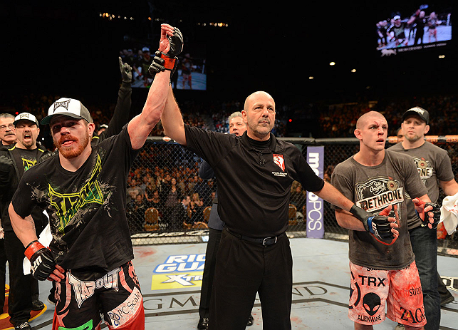 LAS VEGAS, NV - DECEMBER 29:  Jim Miller (left) reacts to being declared the winner over Joe Lauzon (right) after their lightweight fight at UFC 155 on December 29, 2012 at MGM Grand Garden Arena in Las Vegas, Nevada. (Photo by Donald Miralle/Zuffa LLC/Zuffa LLC via Getty Images) *** Local Caption *** Joe Lauzon; Jim Miller