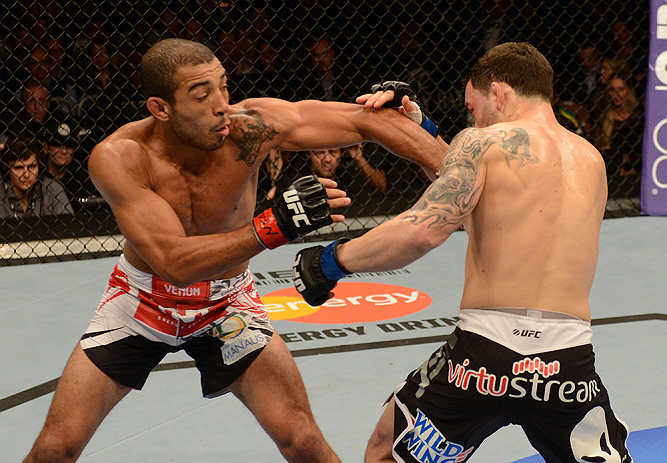 LAS VEGAS, NV - FEBRUARY 02: (L-R) Jose Aldo punches Frankie Edgar during their featherweight title fight at UFC 156 on February 2, 2013 at the Mandalay Bay Events Center in Las Vegas, Nevada. (Photo by Donald Miralle/Zuffa LLC/Zuffa LLC via Getty Images) *** Local Caption *** Jose Aldo; Frankie Edgar
