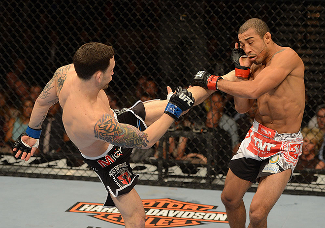 LAS VEGAS, NV - FEBRUARY 02: (L-R) Frankie Edgar kicks Jose Aldo during their featherweight title fight at UFC 156 on February 2, 2013 at the Mandalay Bay Events Center in Las Vegas, Nevada. (Photo by Donald Miralle/Zuffa LLC/Zuffa LLC via Getty Images) *** Local Caption *** Jose Aldo; Frankie Edgar