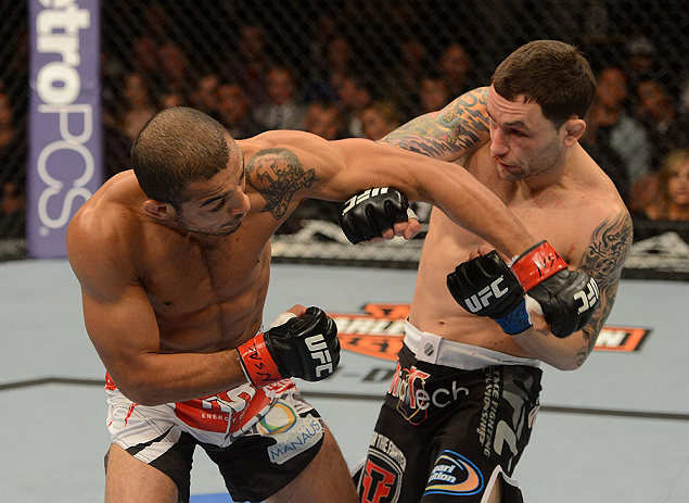 LAS VEGAS, NV - FEBRUARY 02: (L-R) Jose Aldo punches Frankie Edgar during their featherweight title fight at UFC 156 on February 2, 2013 at the Mandalay Bay Events Center in Las Vegas, Nevada. (Photo by Donald Miralle/Zuffa LLC/Zuffa LLC via Getty Images) *** Local Caption *** Jose Aldo; Frankie Edgar