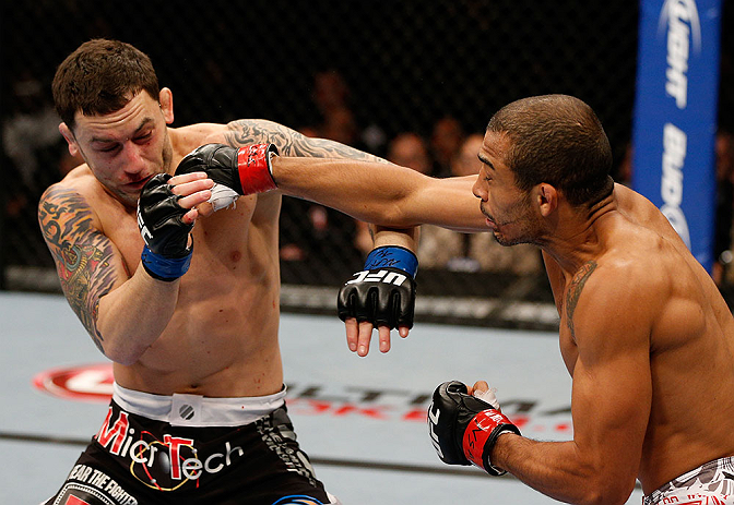 LAS VEGAS, NV - FEBRUARY 02: (R-L) Jose Aldo punches Frankie Edgar during their featherweight title fight at UFC 156 on February 2, 2013 at the Mandalay Bay Events Center in Las Vegas, Nevada. (Photo by Josh Hedges/Zuffa LLC/Zuffa LLC via Getty Images) *** Local Caption *** Jose Aldo; Frankie Edgar
