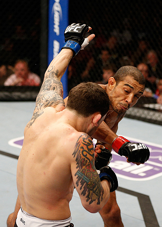 LAS VEGAS, NV - FEBRUARY 02: Jose Aldo (right) punches Frankie Edgar during their featherweight title fight at UFC 156 on February 2, 2013 at the Mandalay Bay Events Center in Las Vegas, Nevada. (Photo by Josh Hedges/Zuffa LLC/Zuffa LLC via Getty Images) *** Local Caption *** Jose Aldo; Frankie Edgar