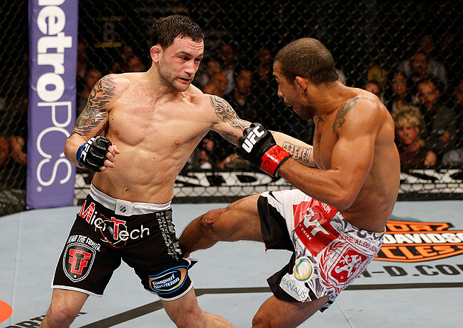 LAS VEGAS, NV - FEBRUARY 02:  (L-R) Frankie Edgar punches Jose Aldo during their featherweight title fight at UFC 156 on February 2, 2013 at the Mandalay Bay Events Center in Las Vegas, Nevada.  (Photo by Josh Hedges/Zuffa LLC/Zuffa LLC via Getty Images) *** Local Caption *** Jose Aldo; Frankie Edgar