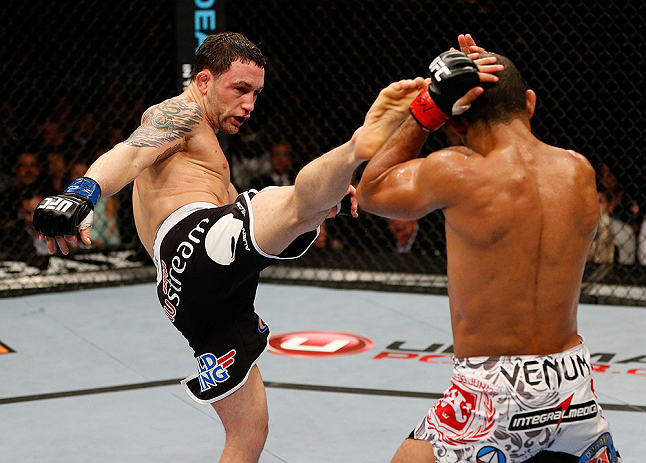 LAS VEGAS, NV - FEBRUARY 02: (L-R) Frankie Edgar kicks Jose Aldo during their featherweight title fight at UFC 156 on February 2, 2013 at the Mandalay Bay Events Center in Las Vegas, Nevada. (Photo by Josh Hedges/Zuffa LLC/Zuffa LLC via Getty Images) *** Local Caption *** Jose Aldo; Frankie Edgar