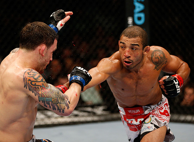 LAS VEGAS, NV - FEBRUARY 02:  (R-L) Jose Aldo punches Frankie Edgar during their featherweight title fight at UFC 156 on February 2, 2013 at the Mandalay Bay Events Center in Las Vegas, Nevada.  (Photo by Josh Hedges/Zuffa LLC/Zuffa LLC via Getty Images) *** Local Caption *** Jose Aldo; Frankie Edgar