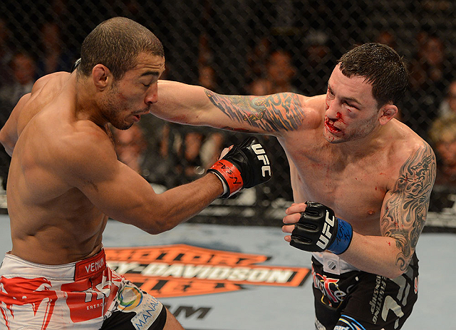 LAS VEGAS, NV - FEBRUARY 02:  (R-L) Frankie Edgar punches Jose Aldo during their featherweight title fight at UFC 156 on February 2, 2013 at the Mandalay Bay Events Center in Las Vegas, Nevada.  (Photo by Donald Miralle/Zuffa LLC/Zuffa LLC via Getty Images) *** Local Caption *** Jose Aldo; Frankie Edgar