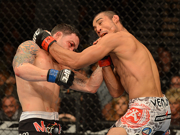 LAS VEGAS, NV - FEBRUARY 02: (L-R) Frankie Edgar punches Jose Aldo during their featherweight title fight at UFC 156 on February 2, 2013 at the Mandalay Bay Events Center in Las Vegas, Nevada. (Photo by Donald Miralle/Zuffa LLC/Zuffa LLC via Getty Images) *** Local Caption *** Jose Aldo; Frankie Edgar