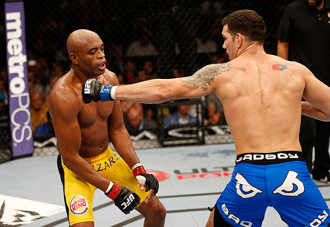 LAS VEGAS, NV - JULY 06:  (R-L) Chris Weidman punches Anderson Silva in their UFC middleweight championship fight during the UFC 162 event inside the MGM Grand Garden Arena on July 6, 2013 in Las Vegas, Nevada.  (Photo by Josh Hedges/Zuffa LLC/Zuffa LLC via Getty Images) *** Local Caption *** Anderson Silva; Chris Weidman