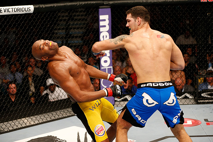 LAS VEGAS, NV - JULY 06:  (R-L) Chris Weidman punches Anderson Silva in their UFC middleweight championship fight during the UFC 162 event inside the MGM Grand Garden Arena on July 6, 2013 in Las Vegas, Nevada.  (Photo by Josh Hedges/Zuffa LLC/Zuffa LLC via Getty Images) *** Local Caption *** Anderson Silva; Chris Weidman