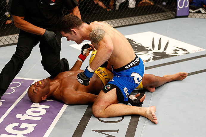 LAS VEGAS, NV - JULY 06:  (R-L) Chris Weidman punches Anderson Silva in their UFC middleweight championship fight during the UFC 162 event inside the MGM Grand Garden Arena on July 6, 2013 in Las Vegas, Nevada.  (Photo by Josh Hedges/Zuffa LLC/Zuffa LLC via Getty Images) *** Local Caption *** Anderson Silva; Chris Weidman