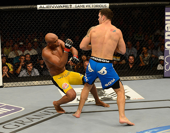 LAS VEGAS, NV - JULY 06:  (R-L) Chris Weidman punches Anderson Silva in their UFC middleweight championship fight during the UFC 162 event inside the MGM Grand Garden Arena on July 6, 2013 in Las Vegas, Nevada.  (Photo by Donald Miralle/Zuffa LLC/Zuffa LLC via Getty Images) *** Local Caption *** Anderson Silva; Chris Weidman