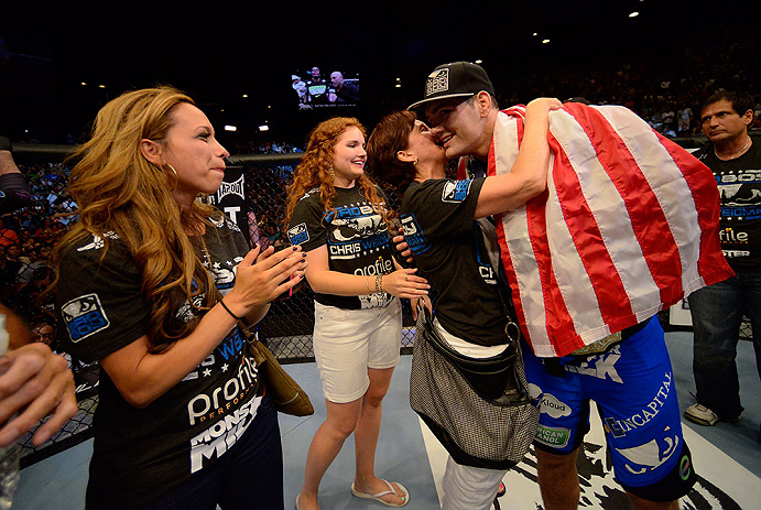 LAS VEGAS, NV - JULY 06:  Chris Weidman (right) celebrates with his family after his victory over Anderson Silva in their UFC middleweight championship fight during the UFC 162 event inside the MGM Grand Garden Arena on July 6, 2013 in Las Vegas, Nevada.  (Photo by Donald Miralle/Zuffa LLC/Zuffa LLC via Getty Images) *** Local Caption *** Anderson Silva; Chris Weidman