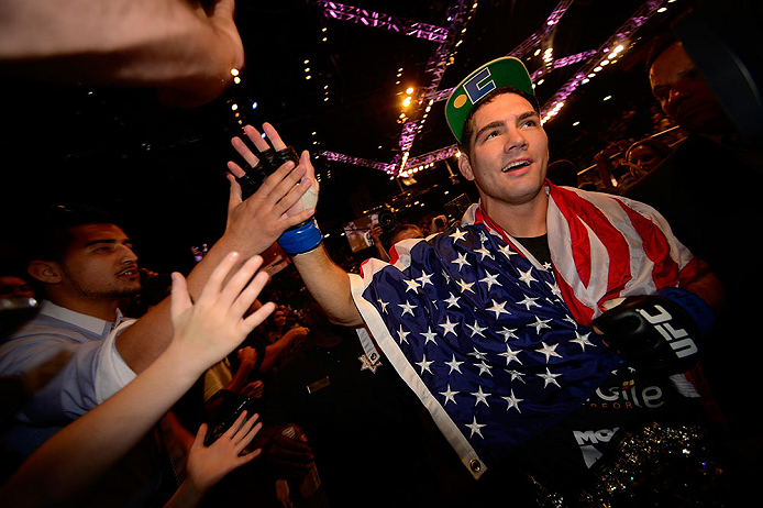 LAS VEGAS, NV - JULY 06:  Chris Weidman with fans after his victory over Anderson Silva in their UFC middleweight championship fight during the UFC 162 event inside the MGM Grand Garden Arena on July 6, 2013 in Las Vegas, Nevada.  (Photo by Donald Miralle/Zuffa LLC/Zuffa LLC via Getty Images) *** Local Caption *** Anderson Silva; Chris Weidman