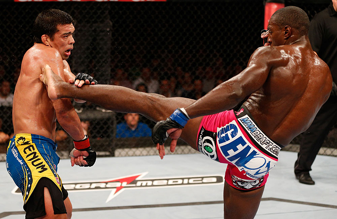 RIO DE JANEIRO, BRAZIL - AUGUST 03:  (R-L) Phil Davis kicks Lyoto Machida in their light heavyweight bout during UFC 163 at HSBC Arena on August 3, 2013 in Rio de Janeiro, Brazil. (Photo by Josh Hedges/Zuffa LLC/Zuffa LLC via Getty Images)