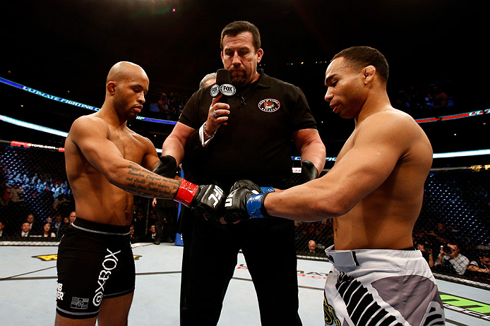 CHICAGO, IL - JANUARY 26:  John Dodson (R) taps gloves with Demetrious Johnson (L) during thier Flyweight Championship Bout part of UFC on FOX at United Center on January 26, 2013 in Chicago, Illinois.  (Photo by Josh Hedges/Zuffa LLC/Zuffa LLC Via Getty Images)
