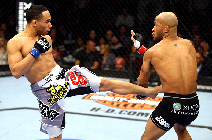 Dodson kicks Johnson during their bout at UFC on FOX on 1/26/13 in Chicago, IL. (Photo by Al Bello/Zuffa LLC)