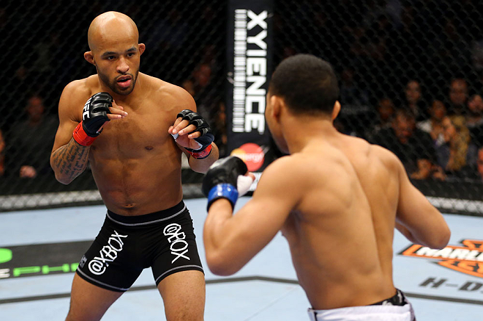 CHICAGO, IL - JANUARY 26:  John Dodson (R) fights Demetrious Johnson (L) during thier Flyweight Championship Bout part of UFC on FOX at United Center on January 26, 2013 in Chicago, Illinois.  (Photo by Al Bello/Zuffa LLC/Zuffa LLC Via Getty Images)