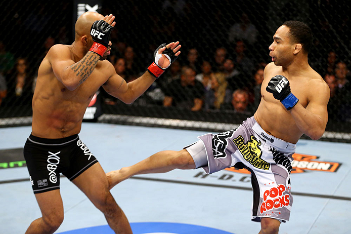 CHICAGO, IL - JANUARY 26:  John Dodson (R) kicks Demetrious Johnson (L) during thier Flyweight Championship Bout part of UFC on FOX at United Center on January 26, 2013 in Chicago, Illinois.  (Photo by Al Bello/Zuffa LLC/Zuffa LLC Via Getty Images)