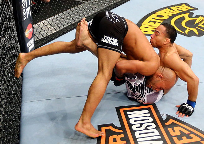 CHICAGO, IL - JANUARY 26:  Demetrious Johnson (L) dumps John Dodson (R) during thier Flyweight Championship Bout part of UFC on FOX at United Center on January 26, 2013 in Chicago, Illinois.  (Photo by Al Bello/Zuffa LLC/Zuffa LLC Via Getty Images)