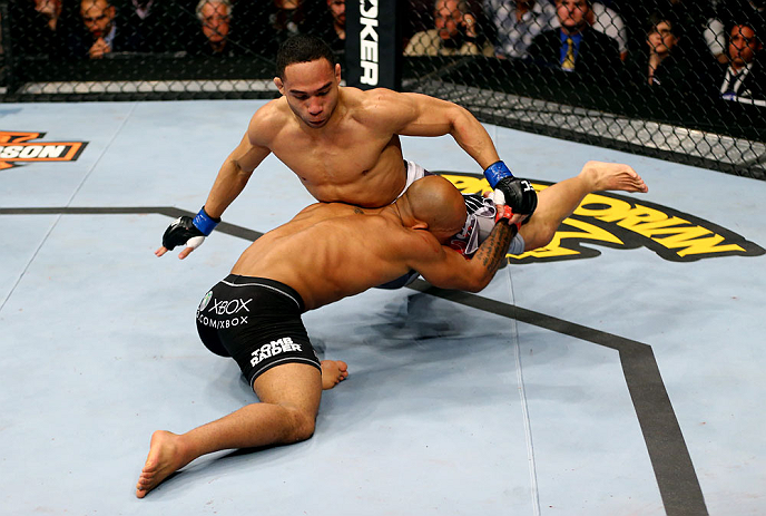 CHICAGO, IL - JANUARY 26:  John Dodson (R) fights Demetrious Johnson (L) during thier Flyweight Championship Bout part of UFC on FOX at United Center on January 26, 2013 in Chicago, Illinois.  (Photo by Al Bello/Zuffa LLC/Zuffa LLC Via Getty Images)