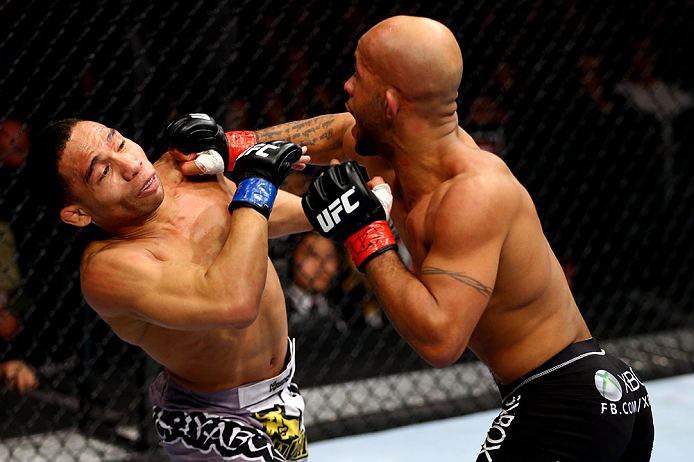 CHICAGO, IL - JANUARY 26:  John Dodson (L) fights Demetrious Johnson (R) during thier Flyweight Championship Bout part of UFC on FOX at United Center on January 26, 2013 in Chicago, Illinois.  (Photo by Al Bello/Zuffa LLC/Zuffa LLC Via Getty Images)