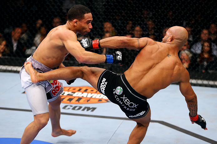 CHICAGO, IL - JANUARY 26:  Demetrious Johnson (R) kicks John Dodson (L) during thier Flyweight Championship Bout part of UFC on FOX at United Center on January 26, 2013 in Chicago, Illinois.  (Photo by Al Bello/Zuffa LLC/Zuffa LLC Via Getty Images)