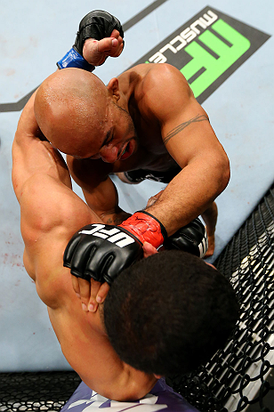 CHICAGO, IL - JANUARY 26:  Demetrious Johnson (Top) punches John Dodson (Bottom) during thier Flyweight Championship Bout part of UFC on FOX at United Center on January 26, 2013 in Chicago, Illinois.  (Photo by Al Bello/Zuffa LLC/Zuffa LLC Via Getty Images)