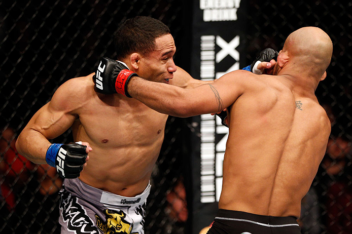 CHICAGO, IL - JANUARY 26:  John Dodson (L) punches Demetrious Johnson (R) during thier Flyweight Championship Bout part of UFC on FOX at United Center on January 26, 2013 in Chicago, Illinois.  (Photo by Josh Hedges/Zuffa LLC/Zuffa LLC Via Getty Images)
