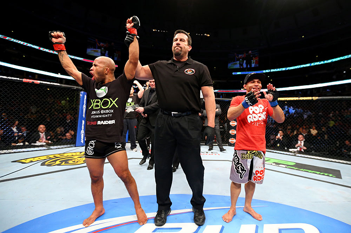 CHICAGO, IL - JANUARY 26:  Demetrious Johnson (L) celebrates defeating John Dodson (R) during thier Flyweight Championship Bout part of UFC on FOX at United Center on January 26, 2013 in Chicago, Illinois.  (Photo by Al Bello/Zuffa LLC/Zuffa LLC Via Getty Images)