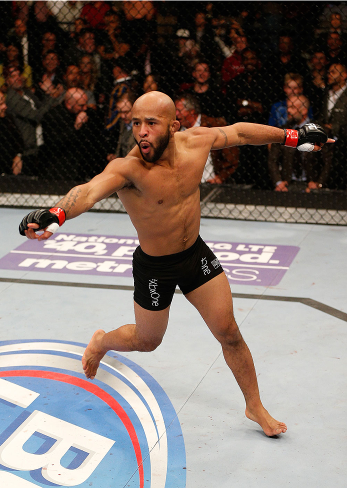 SACRAMENTO, CA - DECEMBER 14:  Demetrious Johnson reacts to his victory over Joseph Benavidez in their flyweight championship bout during the UFC on FOX event at Sleep Train Arena on December 14, 2013 in Sacramento, California. (Photo by Josh Hedges/Zuffa LLC/Zuffa LLC via Getty Images) *** Local Caption *** Demetrious Johnson